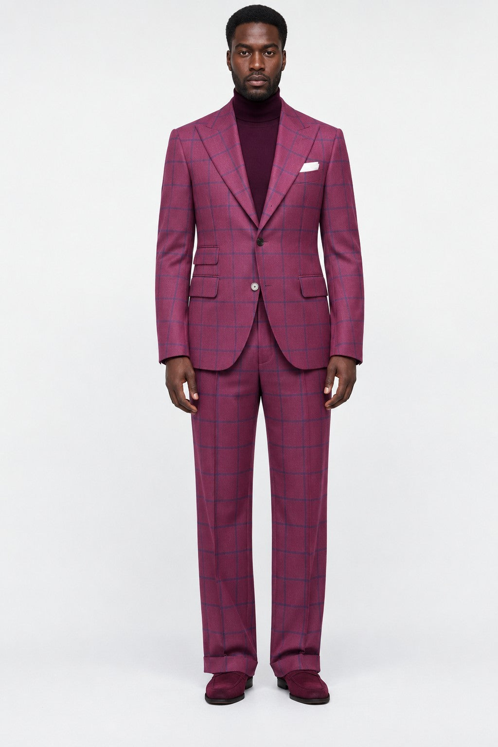 Terry Corbett New York magenta wool suit with navy windowpane check, peak lapels, and tailored trousers on a model.