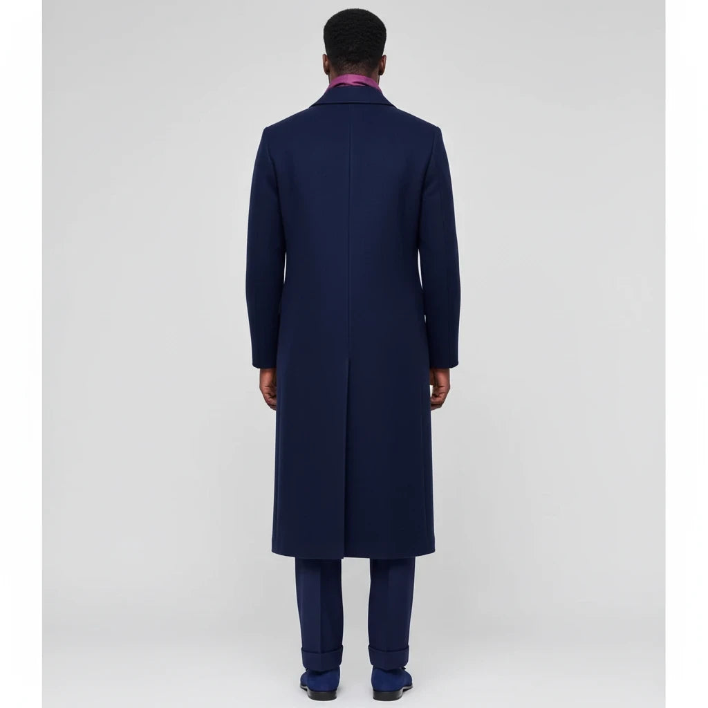 Back view of a man wearing a Terry Corbett New York navy blue wool-blend longline overcoat with a single back vent.