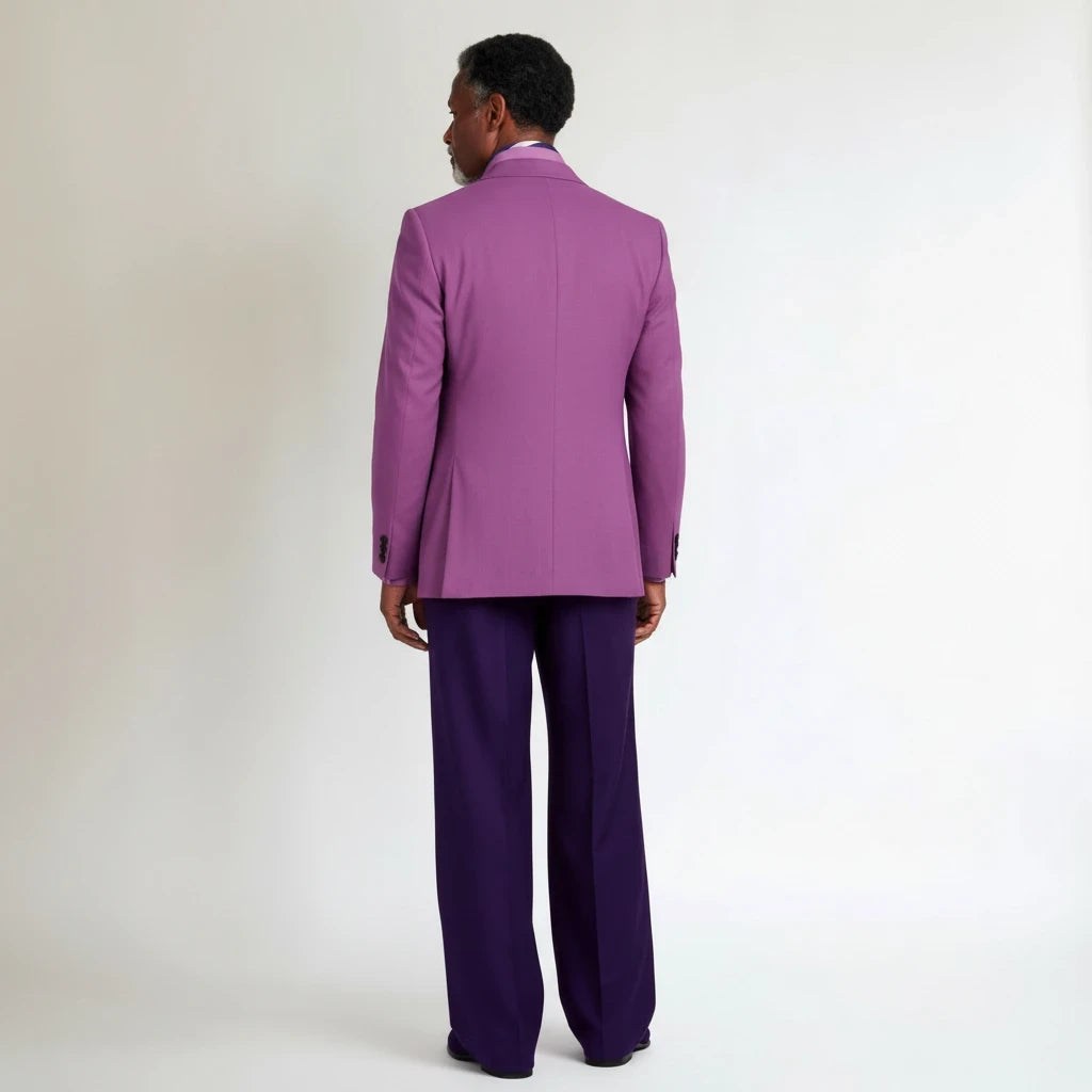 Back view of a man wearing a Terry Corbett New York magenta blazer and deep purple wool blend trousers.