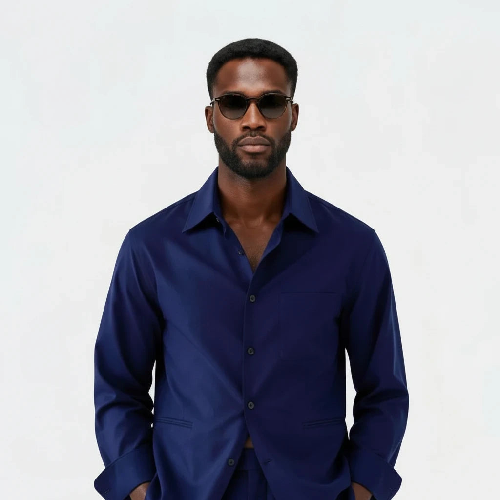 Terry Corbett New York navy button-down shirt worn by a man with sunglasses, featuring a structured collar.