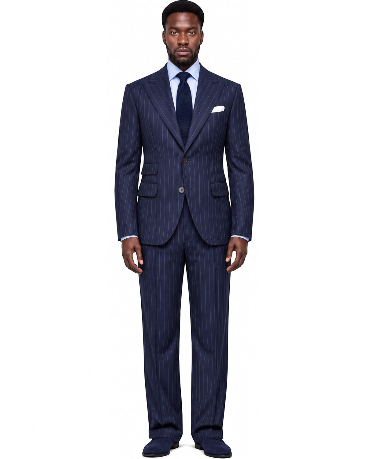 A man wearing a Terry Corbett New York navy wool pinstripe two-piece suit with a light blue shirt and dark tie.
