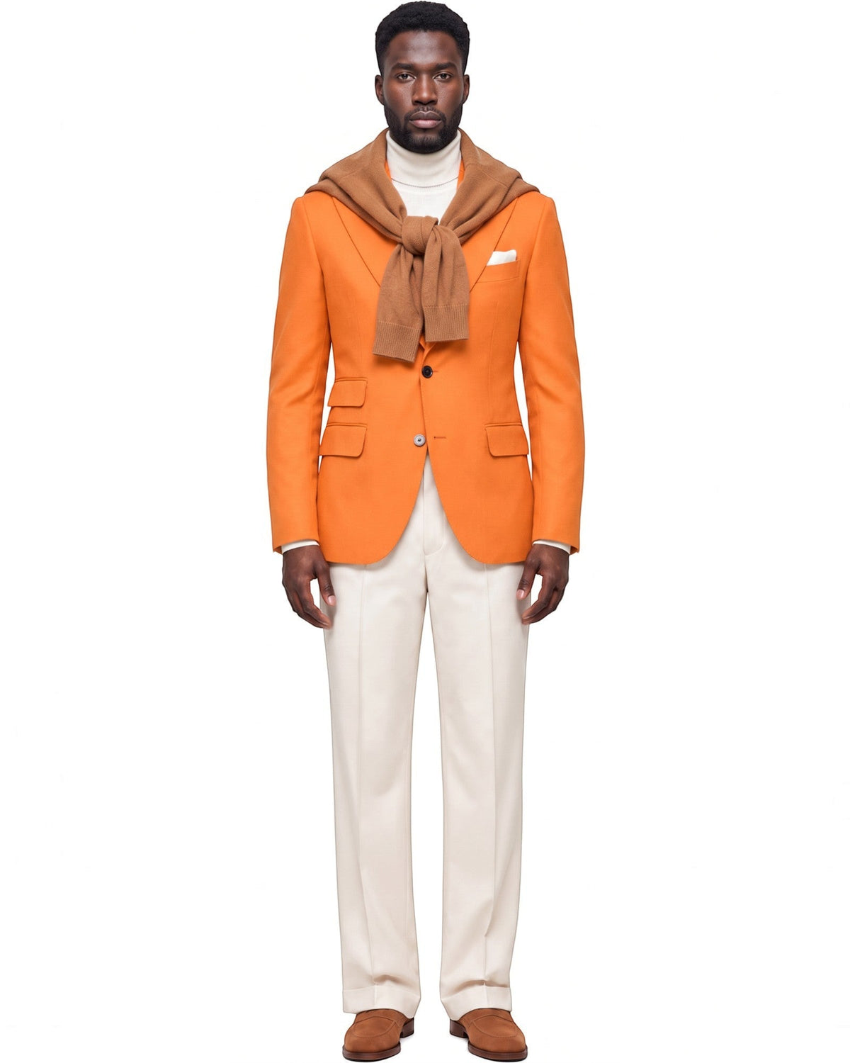 Terry Corbett New York orange tailored single-breasted blazer worn by a man with a cream turtleneck and trousers