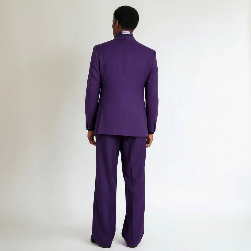 Back view of a man wearing a Terry Corbett New York deep purple tailored two-piece suit with a structured fit.