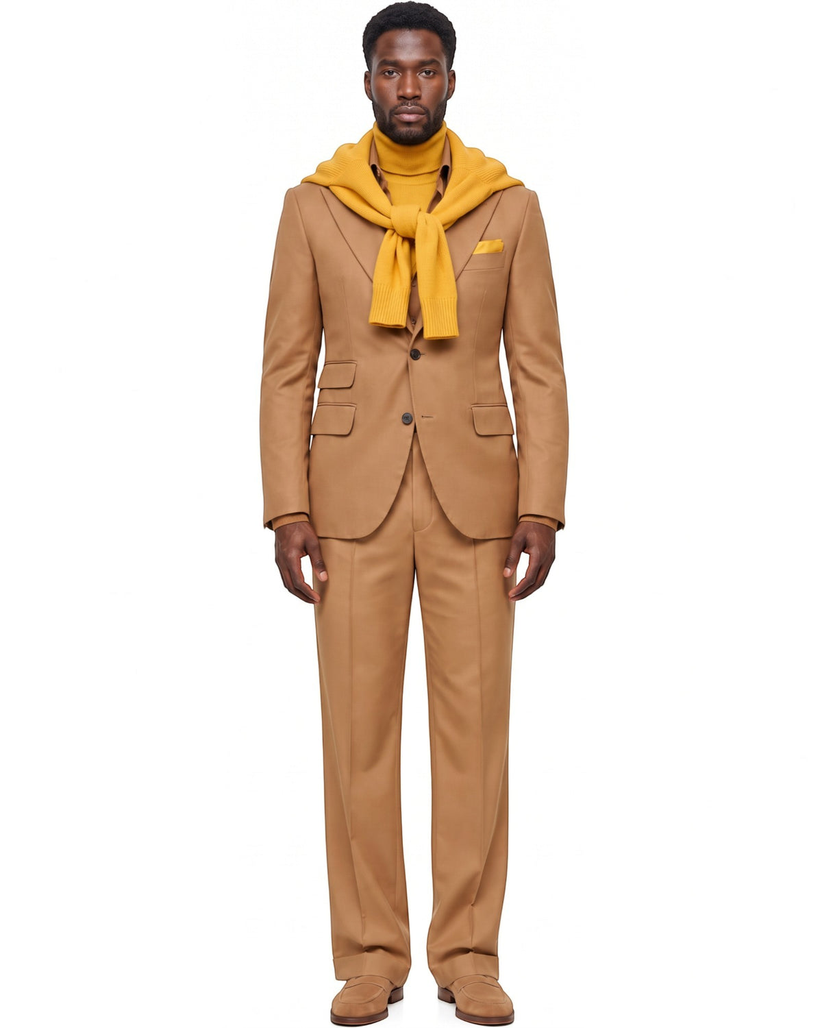 Terry Corbett New York tailored tan two-piece suit worn by a man with a mustard yellow sweater draped over shoulders