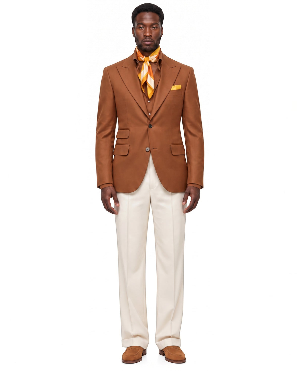 Terry Corbett New York tobacco brown wool blazer with peak lapels worn by a man with a yellow patterned neck scarf